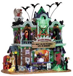 a halloween house with bats and witches on it