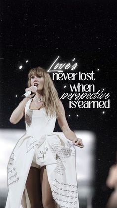 taylor swift singing into a microphone with the words never lost, when everything is learned