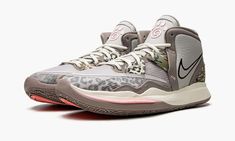 the nike zoom basketball shoe is shown in grey, pink and leopard print with red soles