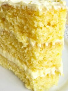 a piece of yellow cake with white frosting