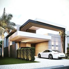 a white car is parked in front of a modern house with palm trees and shrubs