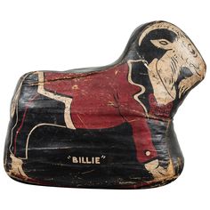 an old wooden rocking horse is painted red and black