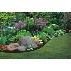 a garden with rocks and flowers in it