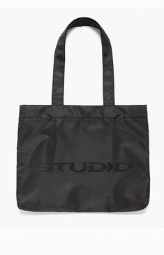 Studio by Supervsn introduces their classic Tote Bag to keep everything you need in one place. With a roomy main compartment, mesh zipper pouch, and iconic logo graphic, this tote bag makes for a functional and cool piece for your streetwear style. 


	Solid color tote bag
	Fixed straps
	Roomy main compartment
	Snap-button closure
	Mesh zipper pouch
	Logo graphic


4% of net proceeds from each Studio Powered by Supervsn product purchased will be donated to the Living Through Giving Foundati Everyday Double Handle Bag With Logo Print, Black Shoulder Bag With Logo Print For Travel, Black Shoulder Bag With Logo Print For Everyday, Modern Shoulder Bag With Logo Print, Black Shoulder Bag With Logo Print, Modern Shoulder Bag With Logo Print For Everyday, Functional Black Bag With Logo Print, Functional Everyday Bags With Logo Print, Functional Bags With Logo Print