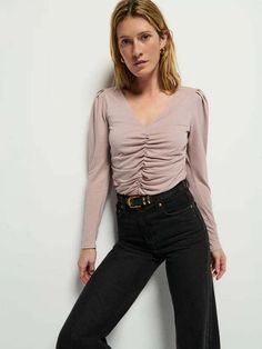 Description:  a flattering shirred-all-over v-neck long sleeve with shoulder pads for subtle puff? yes please.    fabric:  50% pima cotton 50% tencel lyocell  feels lightweight looks luxe    machine washable.  to prevent any slight shrinking air dry or dry on a low setting.  we also recommend washing these items separate from abrasive items like denim towels or items with hardware (zippers buttons) as it causes unnecessary wear and tear.    measurements:  form-fitting.  snug through the bust waist and hips  model is 5'10" and wearing a size s. Rails Clothing, Edwin Jeans, Nation Ltd, Retro Brand, Mother Denim, Yes Please, Shirt Accessories, Fall Trends, Pima Cotton