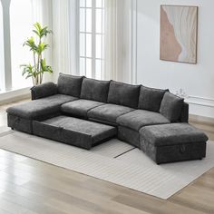 a living room with a sectional couch and rug