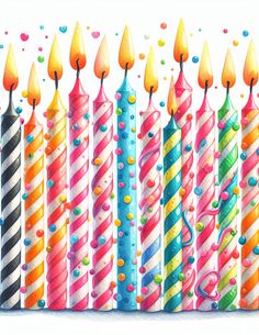 a row of birthday candles with confetti and sprinkles