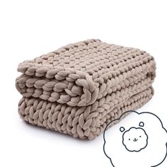 two blankets are stacked on top of each other with a sheep drawn in the middle