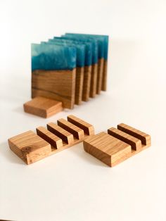 several wooden domino pieces sitting next to each other on top of a white countertop