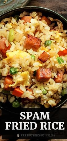 spam fried rice with vegetables in a black bowl