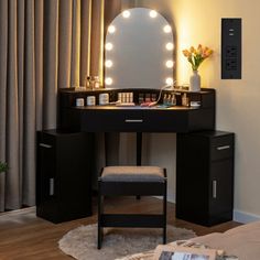 a vanity with lights on it and a stool in front of the mirror that is lit up