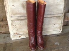 "Vintage Frye Knee High Campus Boots Size 5.5 B US Made in USA ~~ c 1970s USA Frye boots, leather sole and insole, wood stacked heels, interior fabric pull on straps, Frye logo on sides of heels. Stamped \"Made in USA\", \"Frye\" inside, with original Frye label inside. The color is a chocolate brown with a hint of auburn. Measure; 8.5\" sole, 17.5\" height, 14\" circumference, 8.5\" insole, heel height 3\" width 3.25\", Please check all measurements well & refer to sizing chart below for si Fry Boots, Wide Calf Brown Boots, Chocolate Brown Boots, Frye Campus Boots, Campus Boots, Boots Wide Calf, Frye Boots, Red Boots, Beautiful Boots