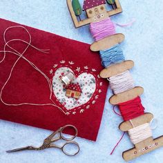 crafting supplies are laid out on a table to be used as decorations for valentine's day