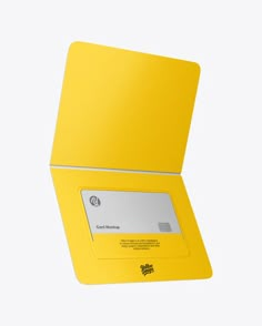 a yellow card holder with a white credit card in it's front and bottom corner