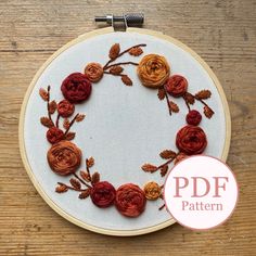 an embroidery kit with flowers on it and the words pdf written in red ink