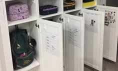 the lockers are filled with many different types of bags and purses on display