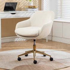 a white office chair sitting on top of a rug in front of a computer desk