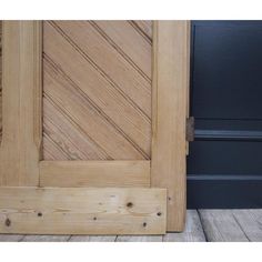 a close up of a wooden door on a building