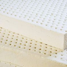 two mattresses side by side with holes in the top and bottom one is white