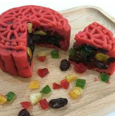 a close up of food on a cutting board with jelly beans and gummy bears