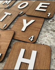 wooden letters and numbers are arranged in the shape of magnets that spell out your home