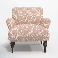 an upholstered chair is shown against a white background