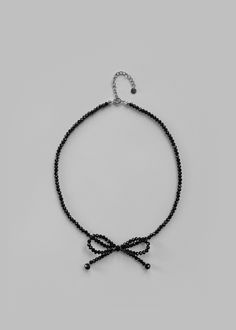 Color: Black Beaded necklace Bow detailing Hook and eye clasp By The Frankie Shop. Imported Beaded Bow Necklace, Swift Friendship Bracelets, Taylor Swift Friendship Bracelets, Beaded Bow, Black Beaded Necklace, Beaded Collar Necklace, The Frankie Shop, Frankie Shop, Bow Necklace