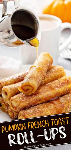 pumpkin french toast roll ups with syrup being drizzled over them on a white plate