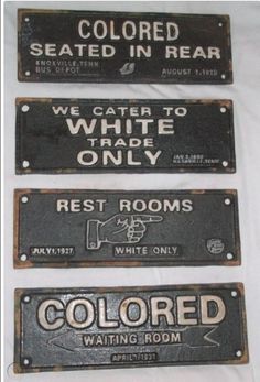 three black and white metal signs with words on the bottom one says,'we came to white trade only rest rooms waiting room '