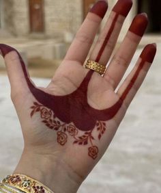 a woman's hand with henna on it