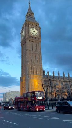 the big ben clock tower towering over the city of london, england at night time