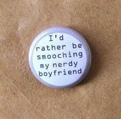 a white button with the words i'd rather be smooching my nerdy boyfriend