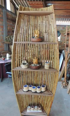 a surfboard shaped shelf with baskets on it