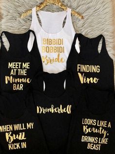 four black and white tank tops with gold lettering on them, one says meet me at the wine bar