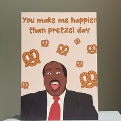 a greeting card with an image of a man in a suit and tie, saying you make me happy than pretzel day