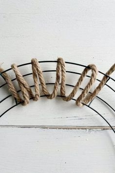 rope wrapped around the word love on a wire rack