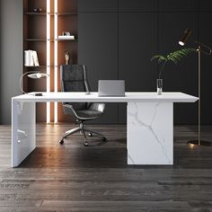 an office desk with a laptop on it in front of a bookcase and shelves