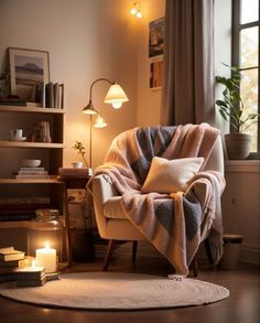 a chair with a blanket on it in front of a window