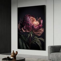 a living room with a couch, coffee table and large flower painting on the wall