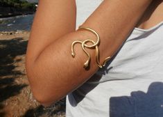 Symbolic Gold Plated Bracelet, Symbolic Brass Bracelet Jewelry, Unique Gold Chain Bracelet For Gift, Handmade Gold-tone Bracelet As Gift, Handmade Symbolic Gold Jewelry, Handmade Gold-tone Bracelet Gift, Flexible Metal Jewelry As A Gift, Adjustable Symbolic Gold Jewelry, Unique Adjustable Gold-plated Jewelry