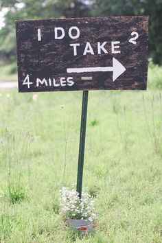 a sign that says i do take 4 miles in front of some grass and trees