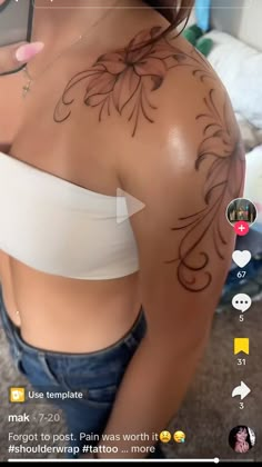 a woman with tattoos on her back holding a cell phone