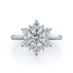 a white gold ring with an oval cut diamond surrounded by small round diamonds on the shan shan shan shan shan shan shan shan shan shan shan shan shan shan shan shan shan shan shan shan shan shan shan shan