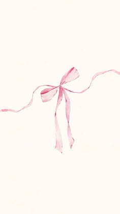 a pink ribbon tied to a white wall