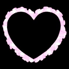 a pink heart shaped object on a black background with the word love spelled in it