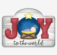 a metal sign that says joy to the world with an image of a baby in a manger