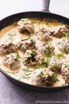 meatballs with gravy in a skillet ready to be served for dinner