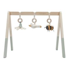 a wooden swing with two toy animals hanging from it's sides