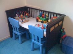 a child's table and chairs in a room