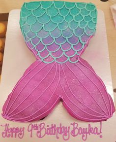 a birthday cake that looks like a mermaid tail